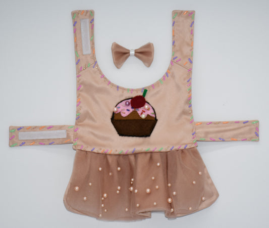 Chocolate Cupcake Fantasy (Chocolat) Dress. All items are Limited Quantity. Custom fabric made from a light brown sateen topped with a darker soft chocolate (chocolat) mesh. Chocolate (chocolat) colored tulle skirt with pearl embellishment. Hand painted sprinkles all over. Multiple layers of paint to give the 3D real sprinkle effect. Hand made felt chocolate cupcake patch with glass pearl and glass bead embellishments topped with a cherry. Matching fabric hair bow with white satin ribbon. 