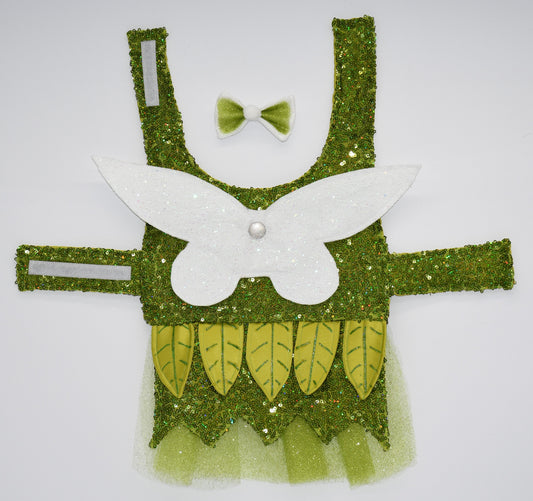 Enchanted Garden Fairy All items are Limited Quantity. Forest Green Mesh Sequin Fabric. Snap on custom Fairy Embossed Wings made from satin and topped with a layer of mesh and another of glitter. Fully lined with Lime Green satin fabric. Velcro added to neck and abdomen for comfort. Hand made and hand painted leaves made from Lime colored Fabric. Green Glitter Tulle Skirt. Matching fabric and Green Glitter Tulle hair bow with small furry orb in center and white satin ribbon. 3x2 in bow