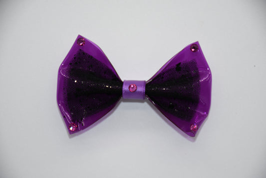 Midnight Orchid. All items are Limited Quantity. Made of Orchid colored clear vinyl fabric.
Midnight tulle glitter fabric and orchid colored satin ribbon.
Carefully hand placed rhinestone details at corners and center.
Hair bow measures 3 inches wide and 2 inches tall.