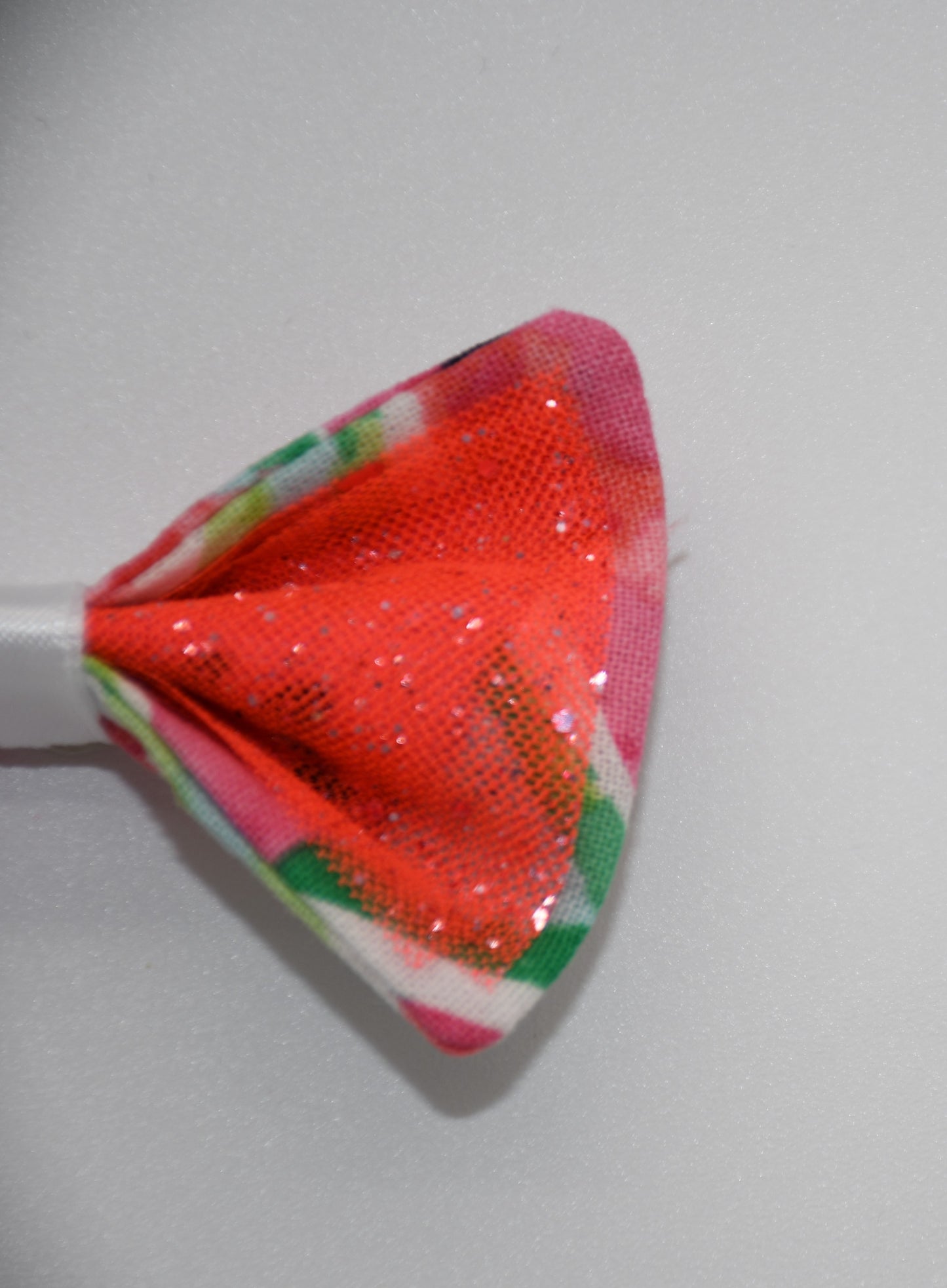 Made of a Watercolor Watermelon print fabric.
Glitter tulle fabric
White satin ribbon.
Hair bow measures 3 inches wide and 2 inches tall.
Head Designer Mister Fashion signs or initials all items on backside or somewhere in the lining.